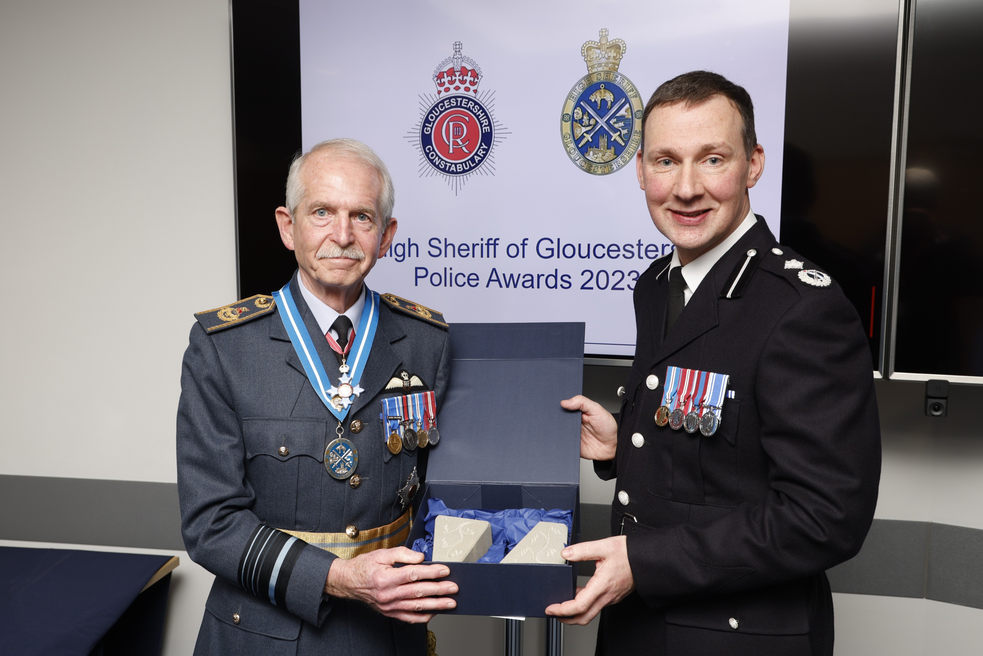 7 March 2023 – Having presented High Sheriff’s Awards to 20 highly deserving police officers, staff and volunteers, DCC Shaun West surprised me with a gift of a pair of bookends hand-carved from local stone.